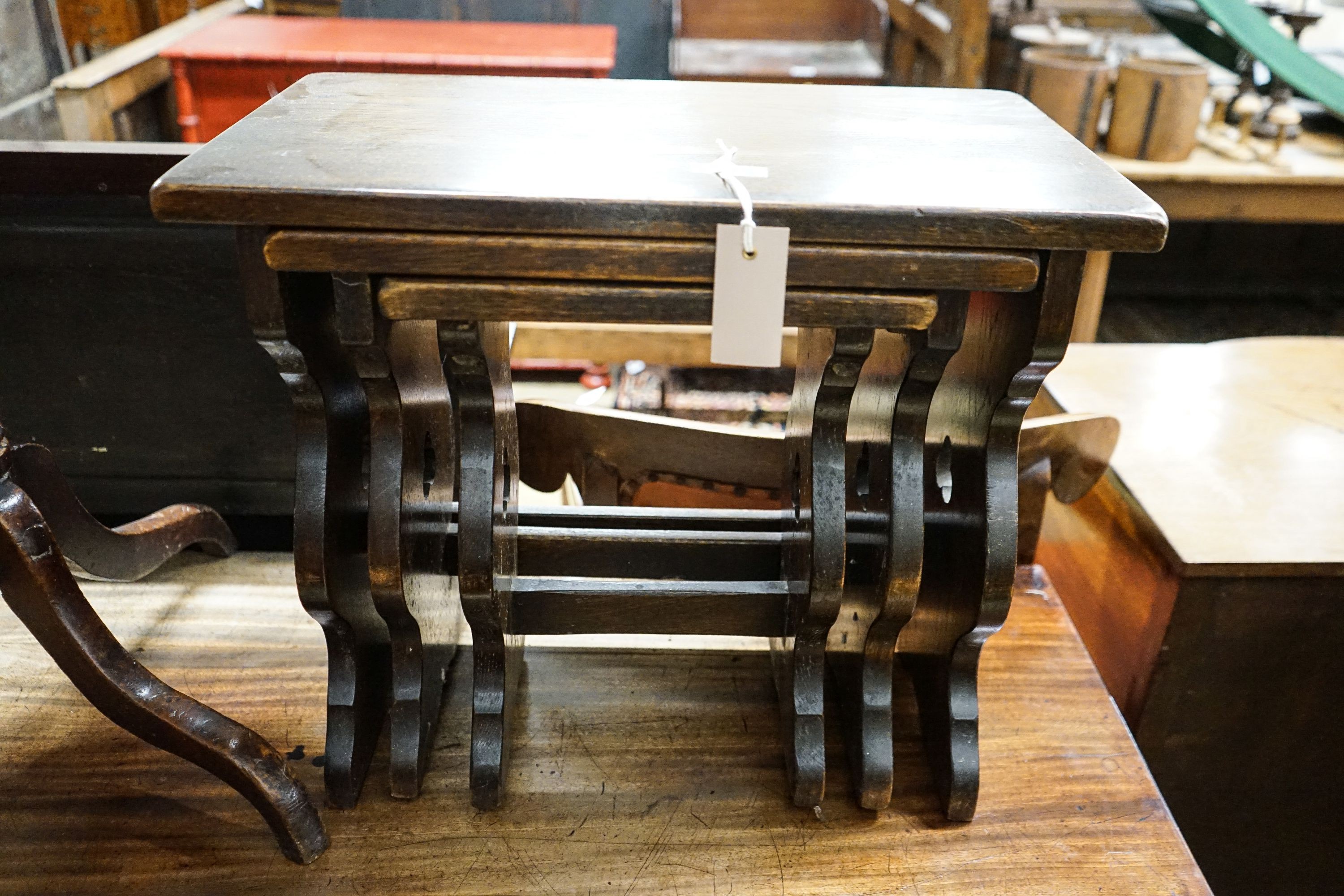 A 19th century circular mahogany tripod wine table, diameter 45cm, height 74cm, together with a nest of tea tables, and a provincial tall oak stool